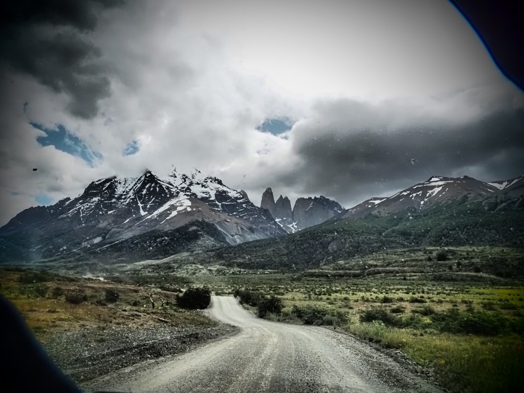 Torres Del Paine National Park, Chile, taken through the windscreen of one of our two off-road vehicles. Not the best roads, but definitely one of the most fun!